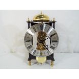 A Hermal skeleton type mantel clock with a key and pendulum, Est £30 - £50.