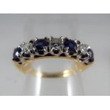 A hallmarked 18 carat gold sapphire diamond ring, approximate size M 1/2, approximate weight 4.