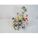 Meissen - a Meissen figural group, depicting a couple, dancing beneath a tree as a musician plays,