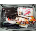 A good quality Antler suitcase containing a quantity of miscellaneous items to include a cased set