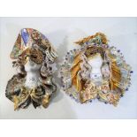 Two ceramic Harlequin wall masks, largest approximately 25 cm x 26 cm [2].