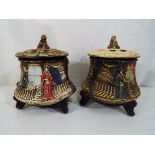 Two ca 1930's lidded pot pourri dishes decorated with Geishas raised on tripod supports,
