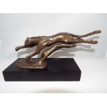 A hot cast bronze depicting a leopard, set on plinth approximate height 12 cm x 25 cm x 8 cm,