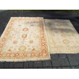 Two decorative rugs one approx 150cm x 210cm and the other 123cm x 175cm [2]