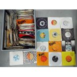 A quantity of 45 rpm vinyl records to include Kate Bush, Stevie Wonder, ABBA, The Beach Boys,