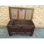 A late 17 th century small formed oak coffer with three panelled top, front and sides,