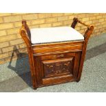 A professionally restored Edwardian carved oak piano stool,