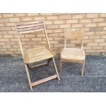 A wooden child school chair and a wooden folding chair (2)