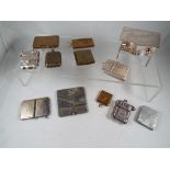 A collection of twelve white metal and yellow metal stamp envelopes and similar