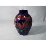 Moorcroft Pottery - a small Moorcroft Pottery vase,