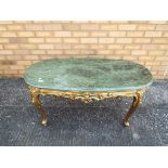 A green marble topped coffee table with gilt wooden base,