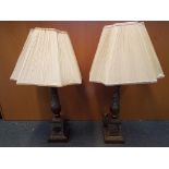 A matching pair of faux marble and gilded metal table lamps,