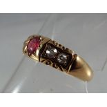 A lady's 18 carat gold halmarked ring set with garnet and four diamonds, size P 1/2,