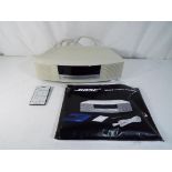 Bose - a Bose wave music system in white with remote model #AWRCC6 Est £50 - £80