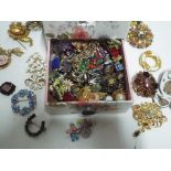 A floral jewellery box containing 25 brooches to include Exquisite,