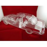 A glass model, depicting BMW saloon car with intaglio detailing approximately 10 cm x 37 cm x 13 cm,