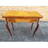 A good quality folding card table with decorative brass mounts approximately 77 cm x 85 cm x 42.