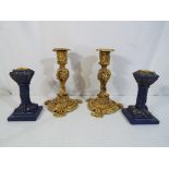 A pair of heavy good quality highly gilded candlesticks,
