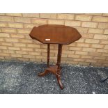 A octagonal topped occasional table on tripod supports approx 72cm x 49cm x 49cm