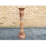 A red marble plant stand measuring approximately 101 cm x 28 cm x 28 cm.