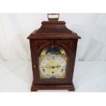 A wood cased Hermel mantel clock, brass dial, Roman numerals to a silvered chapter ring,