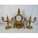 A decorative brass mantel clock,