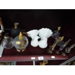 A good mixed lot of predominantly glass perfume bottles and a Lladro figurine depicting two doves