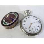 A white metal pocket watch with white enamelled dial,