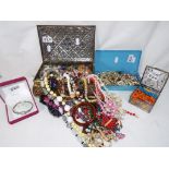 Four jewellery boxes containing a quantity of costume jewellery to include beaded necklaces,
