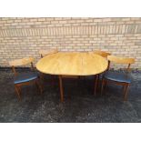 A G plan drop leaf dining table and four chairs,