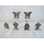 A lot to include six white metal menu holders.