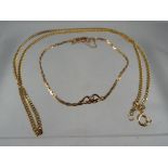 A hallmarked 9 carat gold diamond cut curb chain and a 9 carat gold bracelet with safety chain,