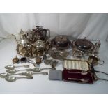 A large quantity of silver plated items to include flatware, serving dishes, coffee pots, tea pot,