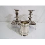 A pair of good quality silver plated candle sticks approximately 14 cm [h] and a small silver