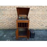 A Columbia Grafonola Type E-2 gramophone in cabinet case with hinged lid over two cabinet doors,