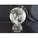 A glass terrestrial globe,