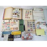 Philately - a lot to include three albums, containing UK and World postage stamps,