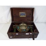 A mahogany cased brass mining dial inscribed John Davis & Son London & Derby,