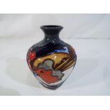 Moorcroft Pottery - a Moorcroft Pottery vase in the 'Brave Sir Robin' design,