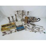 A lot to include a quantity of silver plated items to include candelabra, vases,