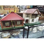 A tin-plate lithographed bungalow doll's house with removable roof,