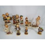 Nine ceramic Hummel figurines by Goebel (qty)