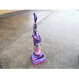 A Dyson DC04 upright vacuum cleaner.