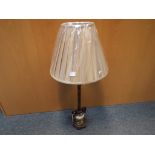 A marble effect lamp with shade,