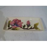 Moorcroft Pottery - a Moorcroft Pottery rectangular tray decorated with pink magnolia on a cream