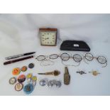 A mixed lot of collectables to include a vintage Smiths travel clock, vintage spectacles, buttons,