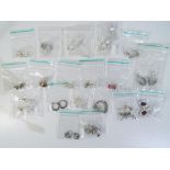 A lot to include twenty pairs of silver earrings in bags, Est £20 - £40.