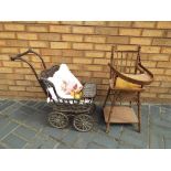 Dolls - A wicker dolls pushchair with a small quantity of soft toys and a vintage dolls high chair.