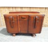 A good quality sideboard having three drawers over three cupboards,