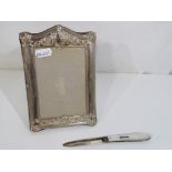 A silver fronted hallmarked photograph frame, approx 17.